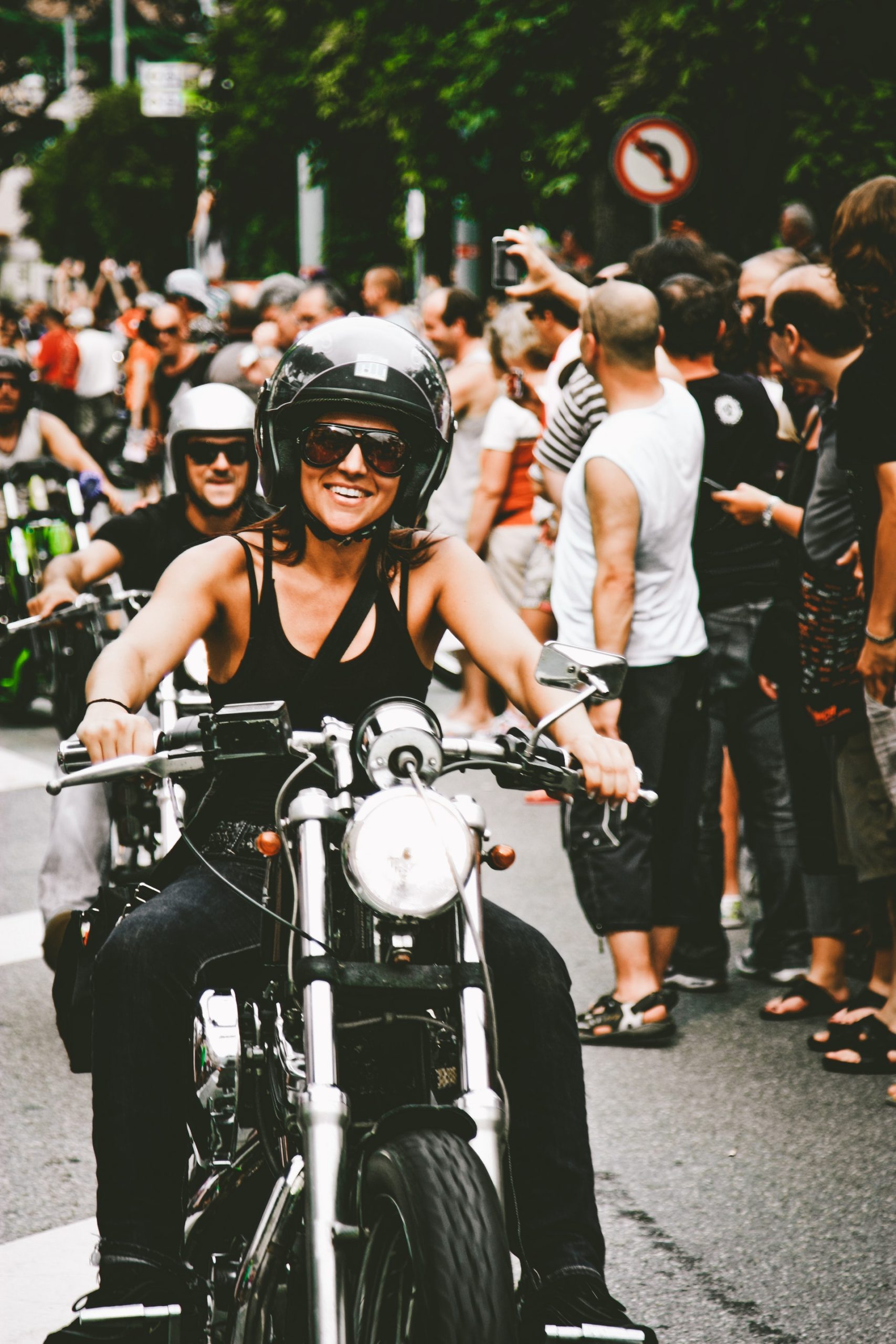 photo-of-woman-wearing-shirt-while-riding-motorcycle-1796308
